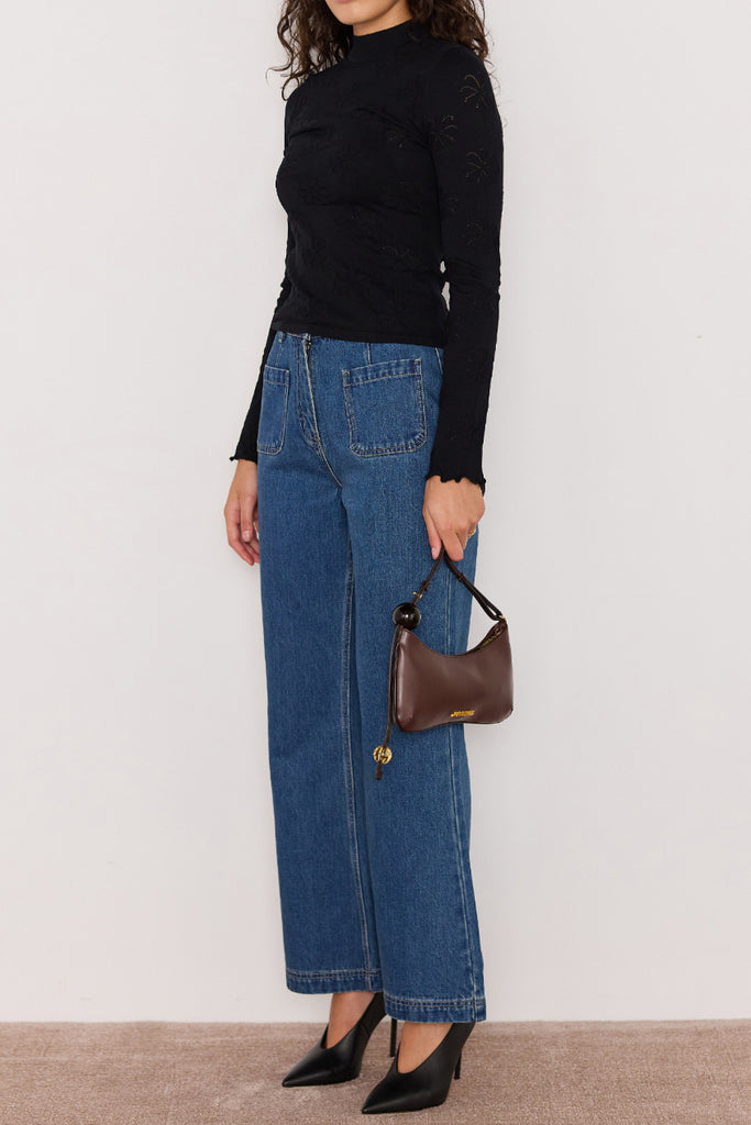 slim-fitting knit top in black with special pointelle detailing throughout