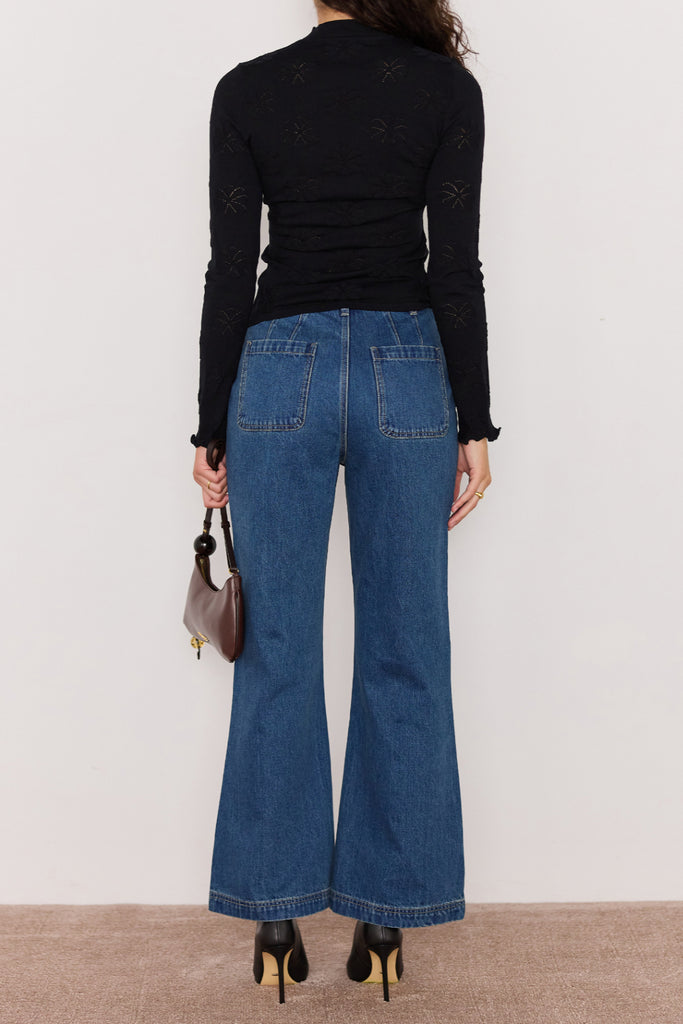 slim-fitting knit top in black with special pointelle detailing throughout