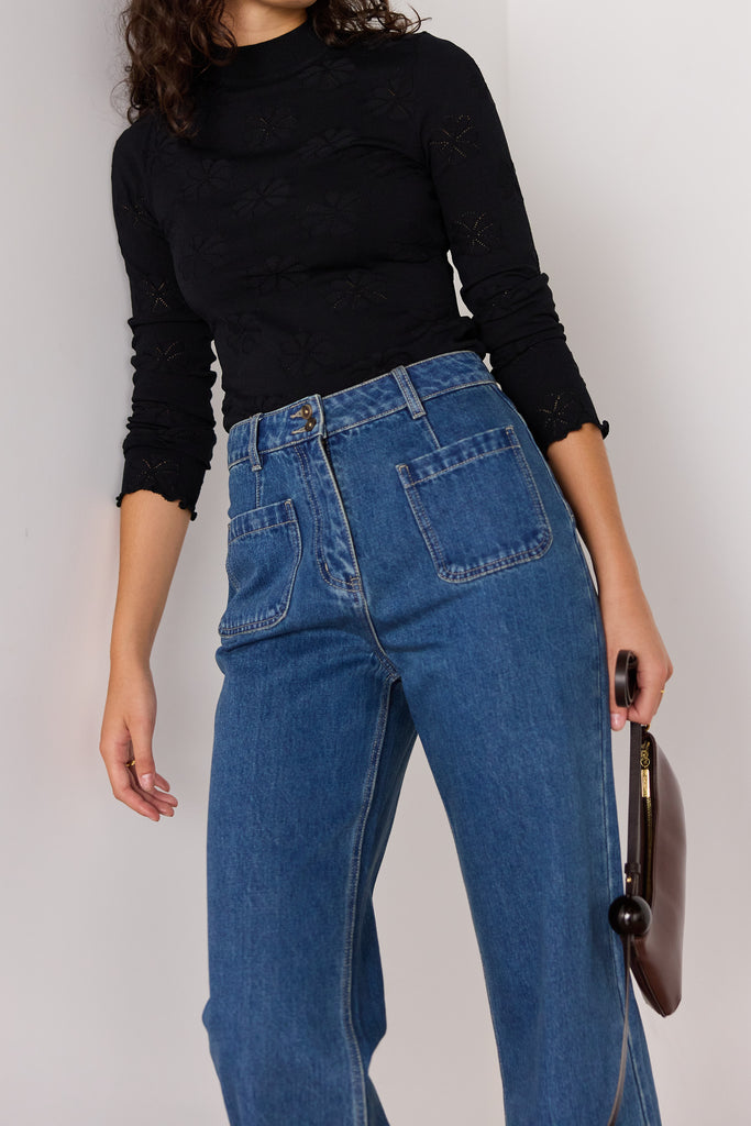 slim-fitting knit top in black with special pointelle detailing throughout