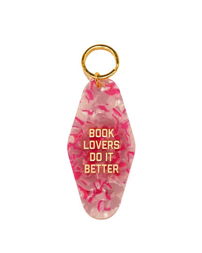 acrylic vintage inspired keychain with the message "book lovers do it better" 