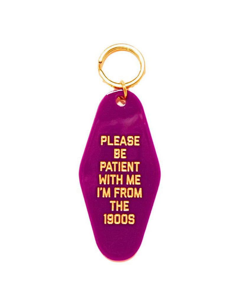 acrylic vintage inspired keychain with the message "please be patient with me i'm from the 1900s"