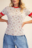fitted ribbed baby tee with a sweet ditsy floral pattern and red ringer details 