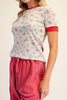 fitted ribbed baby tee with a sweet ditsy floral pattern and red ringer details 