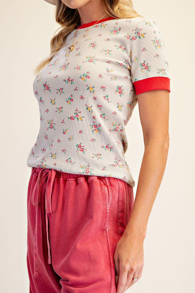 fitted ribbed baby tee with a sweet ditsy floral pattern and red ringer details 