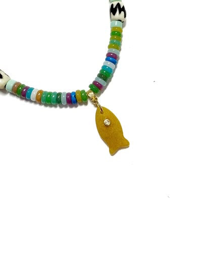 beaded necklace with tan-colored fish charm