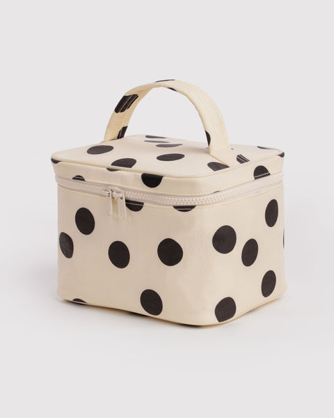 large cosmetic case in a cream and black polka dot print