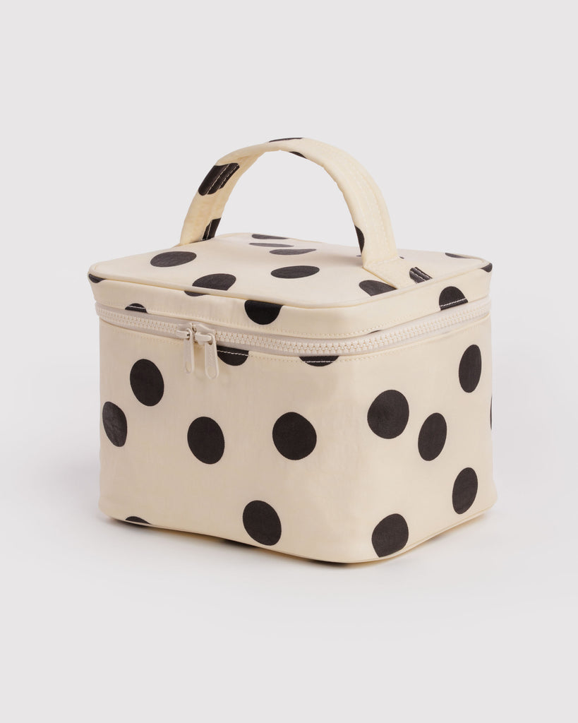 large cosmetic case in a cream and black polka dot print