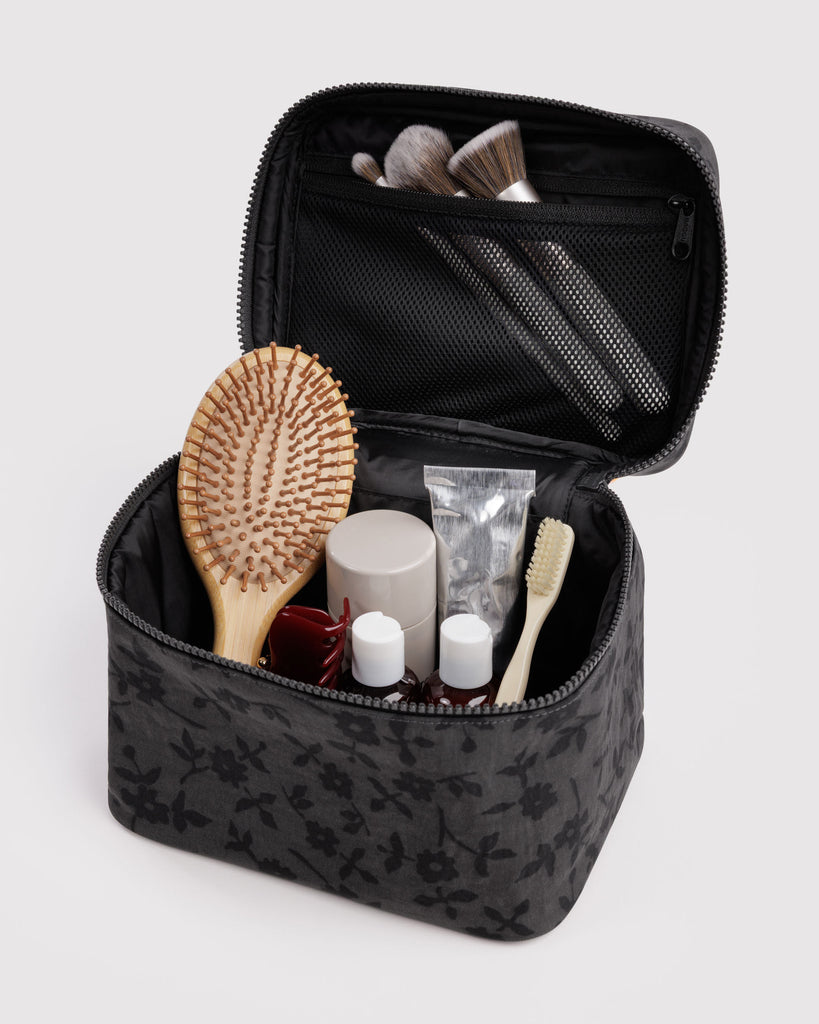 large cosmetic case in a charcoal grey ditsy floral pattern 
