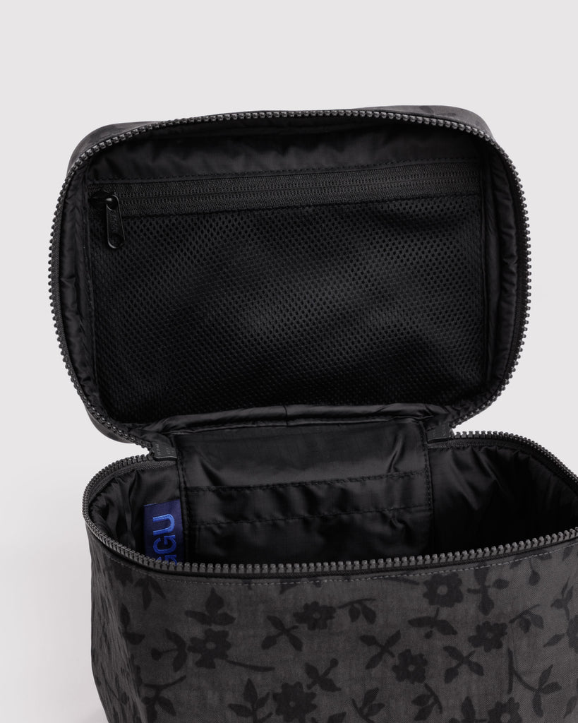 large cosmetic case in a charcoal grey ditsy floral pattern 