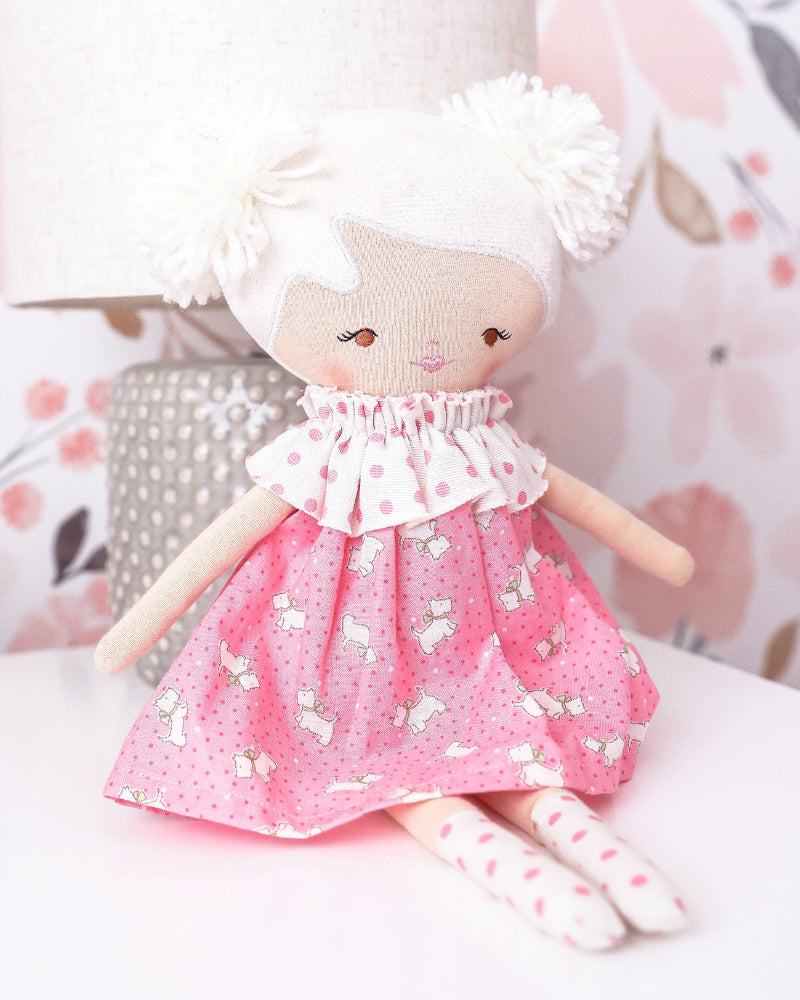 layla doll with a pink puppy printed dress 