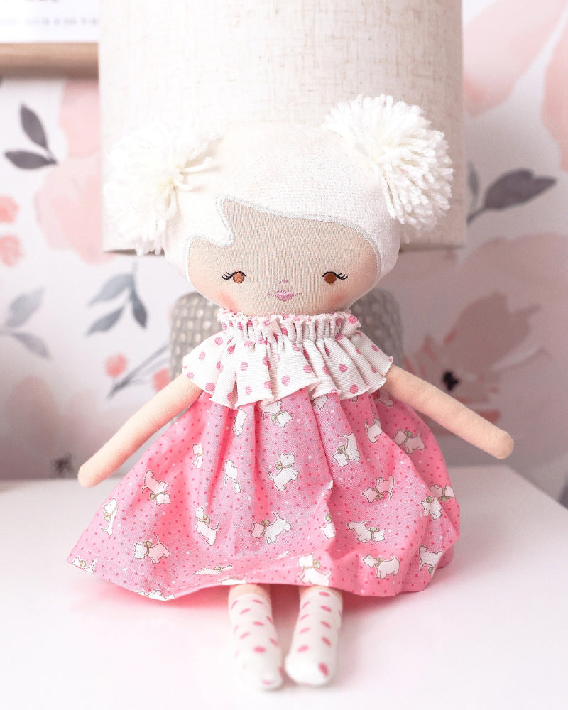 layla doll with a pink puppy printed dress 