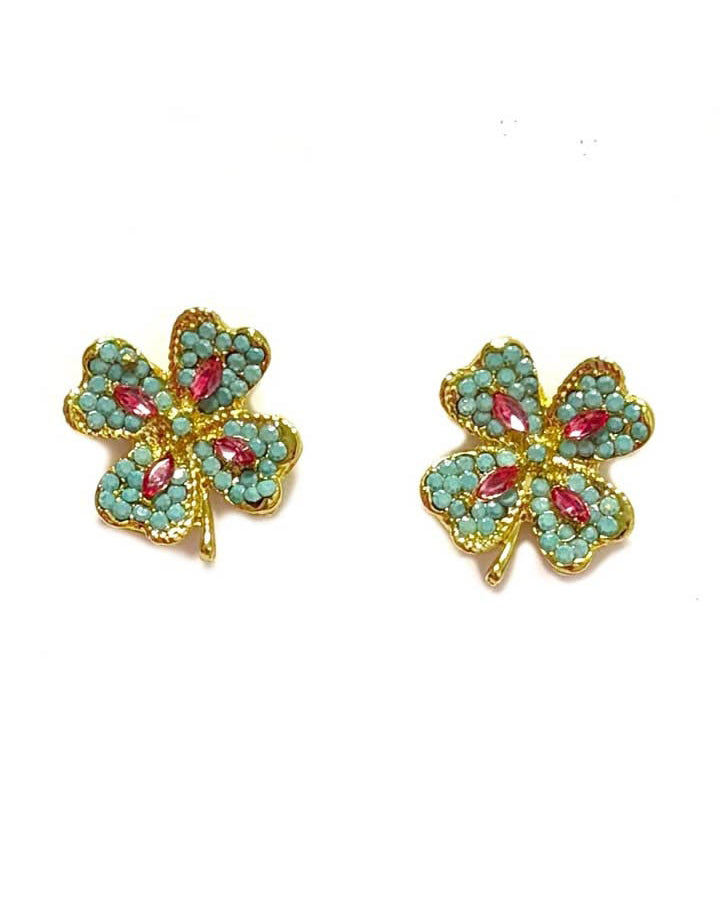 bejeweled earrings in the shape of a four leaf clover 