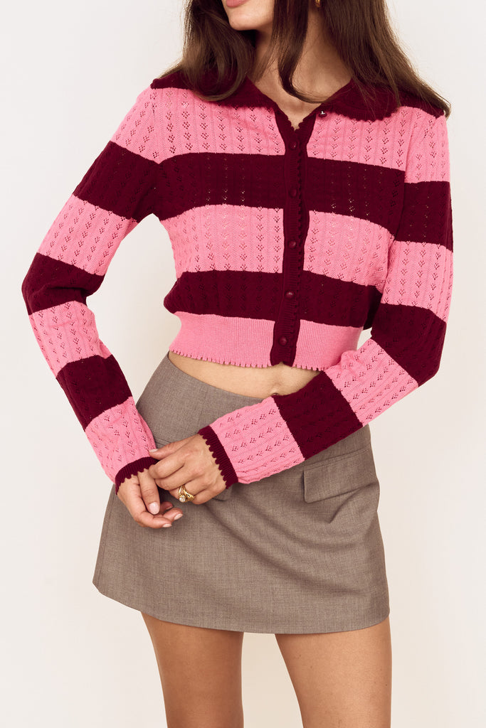 knit cardigan in hot pink and burgundy stripes with a shrunken fit