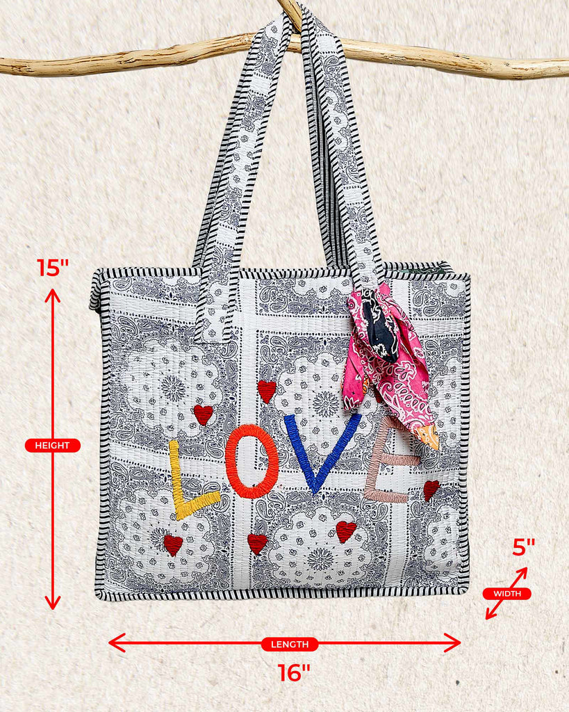 oversized tote bag with a quilted texture and embroidered "love" in bold colors