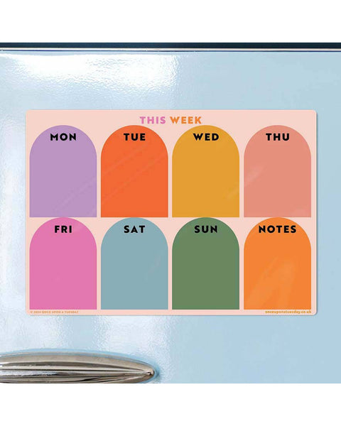 magnetic weekly planner with a colorful rainbow arch design