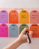magnetic weekly planner with a colorful rainbow arch design