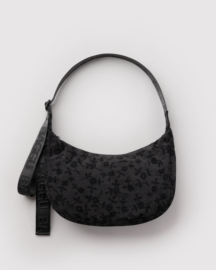 baggu medium nylon crescent bag in a charcoal grey ditsy floral pattern