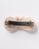 french barrette with a striking moth design in pearly white