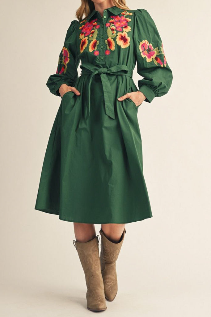 dark green midi dress with colorful floral embroidered details