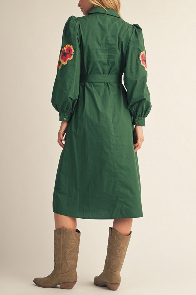 dark green midi dress with colorful floral embroidered details