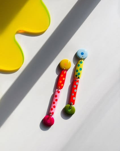 colorful earrings with a mismatched design