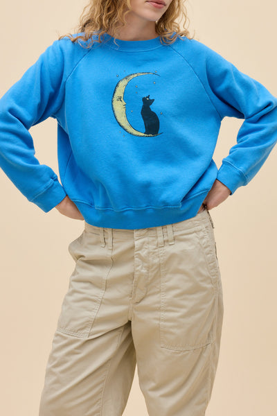 daydreamer shrunken sweatshirt in azure blue with a cat and moon graphic