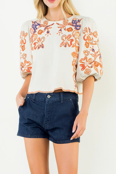 beautifully embroidered top with puff sleeves and a colorful design
