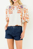 beautifully embroidered top with puff sleeves and a colorful design