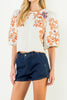 beautifully embroidered top with puff sleeves and a colorful design