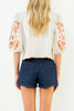 beautifully embroidered top with puff sleeves and a colorful design