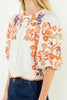 beautifully embroidered top with puff sleeves and a colorful design