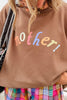 mocha brown sweatshirt with the message "mother!" in a bold and colorful font