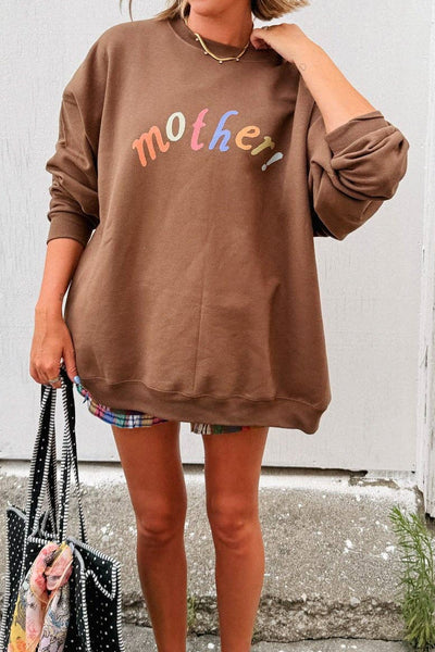 mocha brown sweatshirt with the message "mother!" in a bold and colorful font