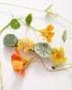 french barrette with green leaves, yellow nasturtiums, and bejeweled beetles