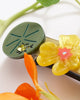 french barrette with green leaves, yellow nasturtiums, and bejeweled beetles