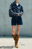 navy blue zip up jacket with cute polka dots throughout