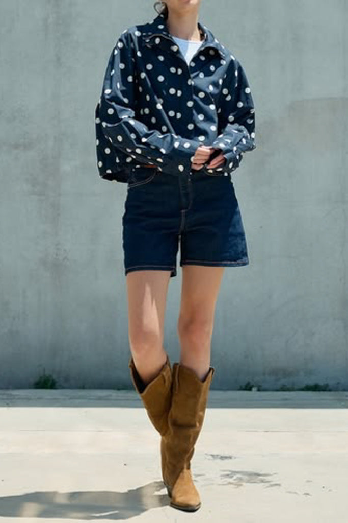 navy blue zip up jacket with cute polka dots throughout