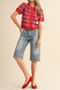 short sleeve button up sweater in red with a colorful floral pattern in cream, burgundy, and light blue.
