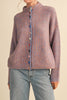 adorable orange and blue vertical striped cardigan with colorful button detailing.