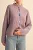 adorable orange and blue vertical striped cardigan with colorful button detailing.