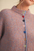 adorable orange and blue vertical striped cardigan with colorful button detailing.