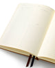 hardcover page a day planner with daisy cover and  ribbon markers