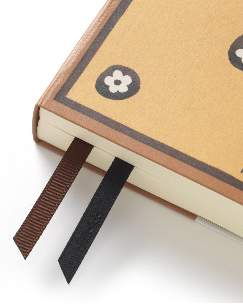 hardcover page a day planner with daisy cover and  ribbon markers