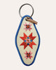 embroidered patch keychain with a vintage-inspired design, quilt star