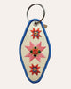 embroidered patch keychain with a vintage-inspired design, quilt star