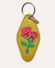 embroidered patch keychain with a vintage-inspired design, roses