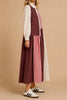 striking maxi dress with a mix print design in burgundy, black, pink, and white