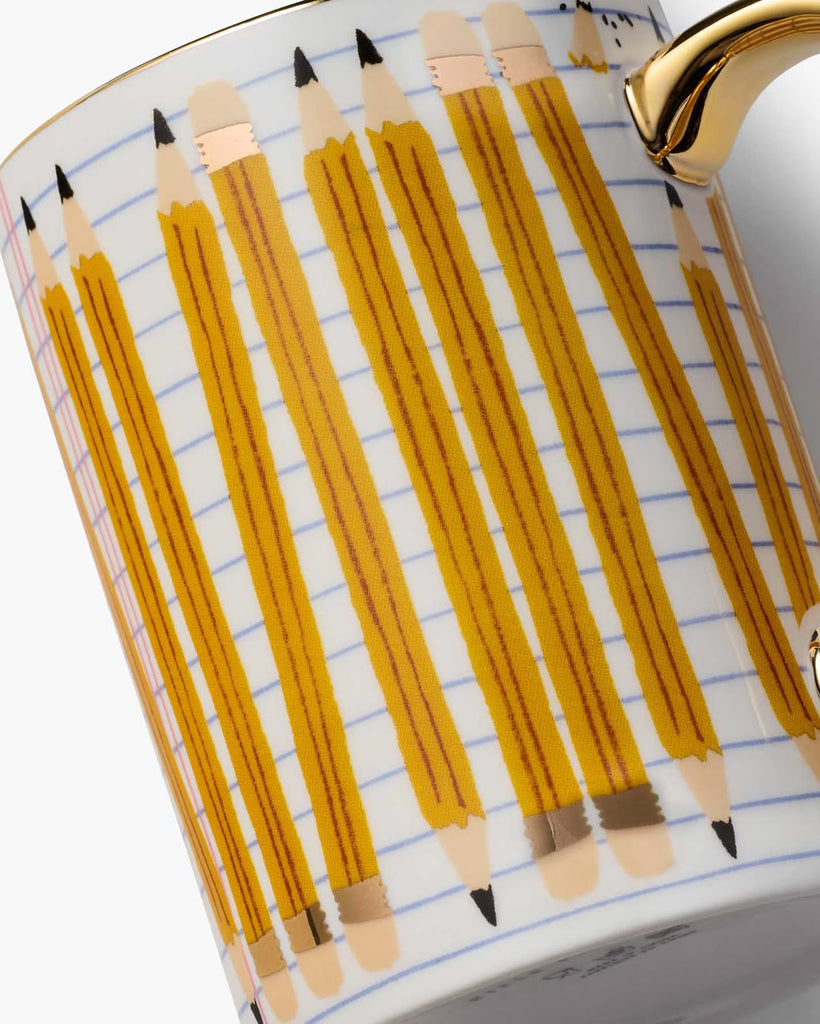white porcelain mug with a pencil design and metallic gold detailing
