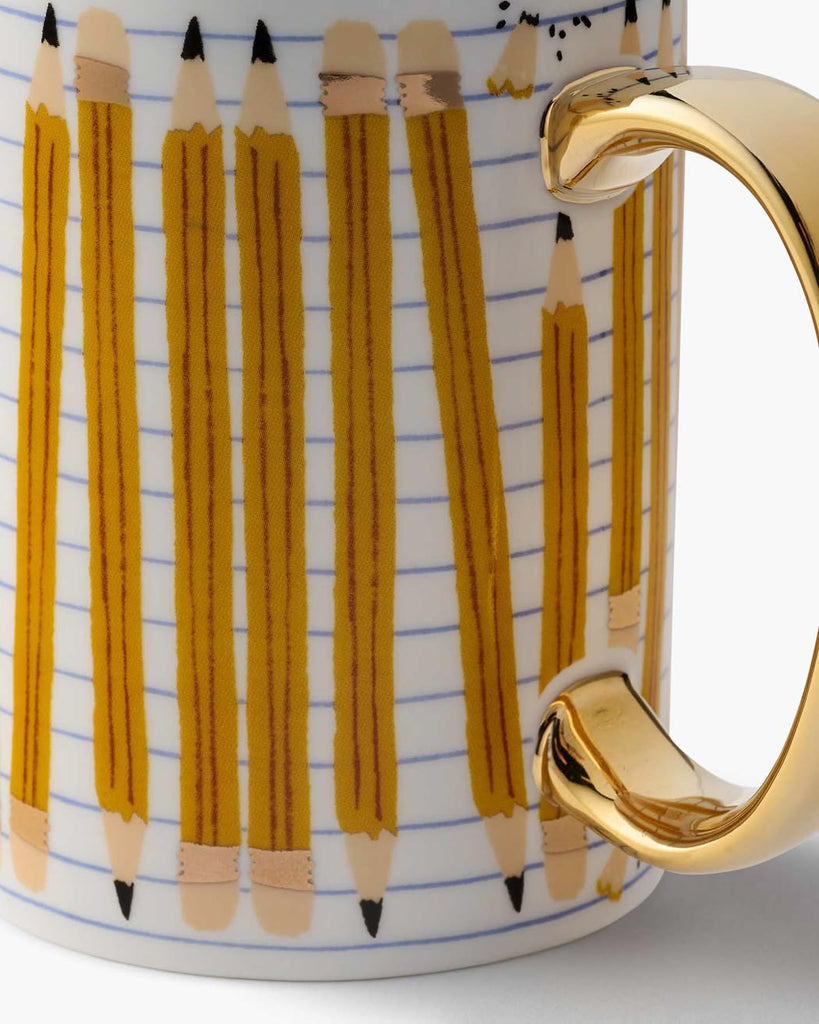 white porcelain mug with a pencil design and metallic gold detailing