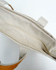 zippered top of mustard yellow canvas tote